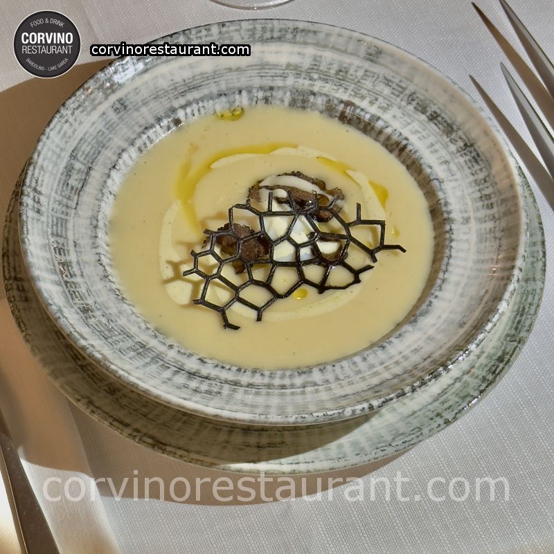 Cream of potatoes with CBT egg and truffle shavings Cream of potatoes with CBT egg and truffle shavings